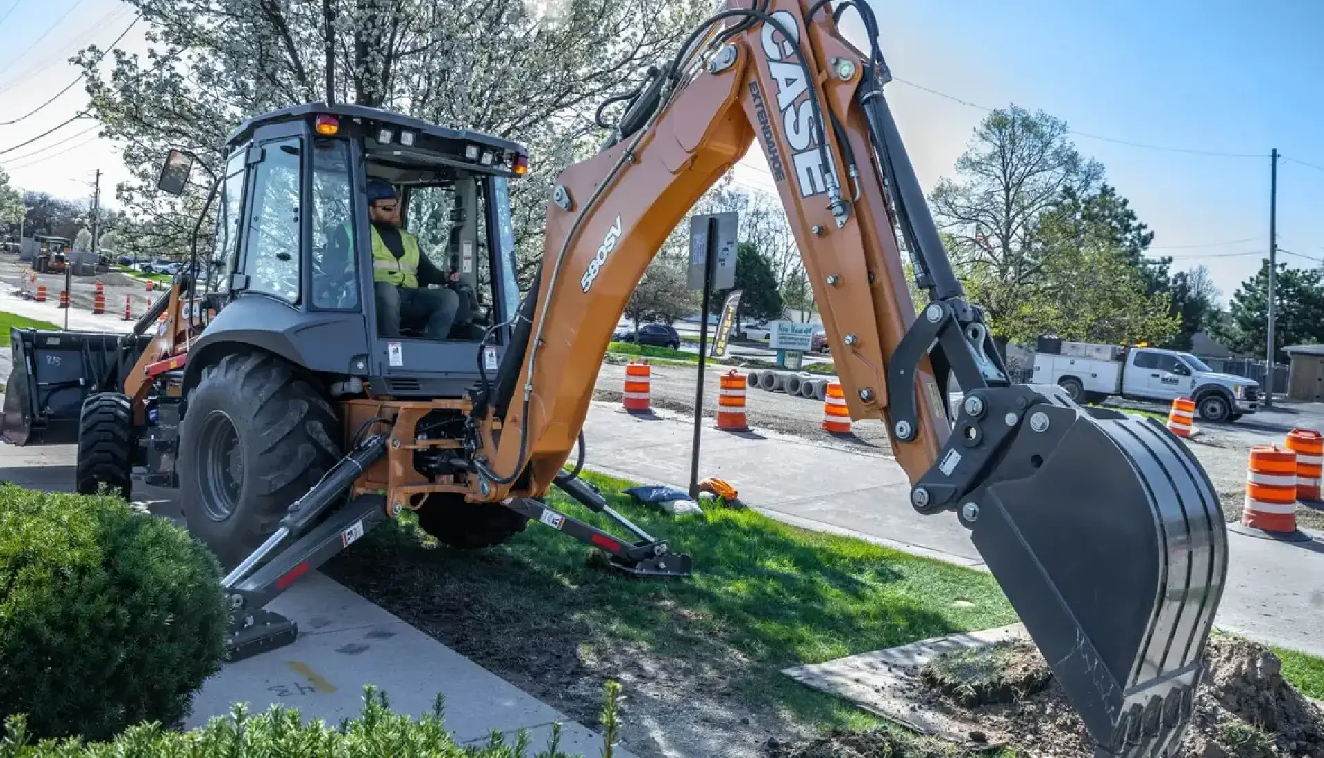 Center-pivot backhoes
